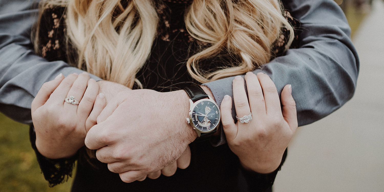 three stone engagement ring and Hamilton watch