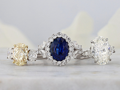 yellow diamond, sapphire, and oval diamond rings