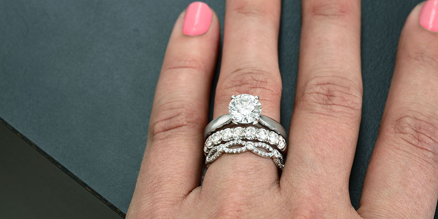 stacked engagement ring with wedding band and anniversary ring