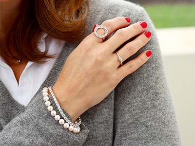 pearl bracelet paired with diamond tennis bracelet