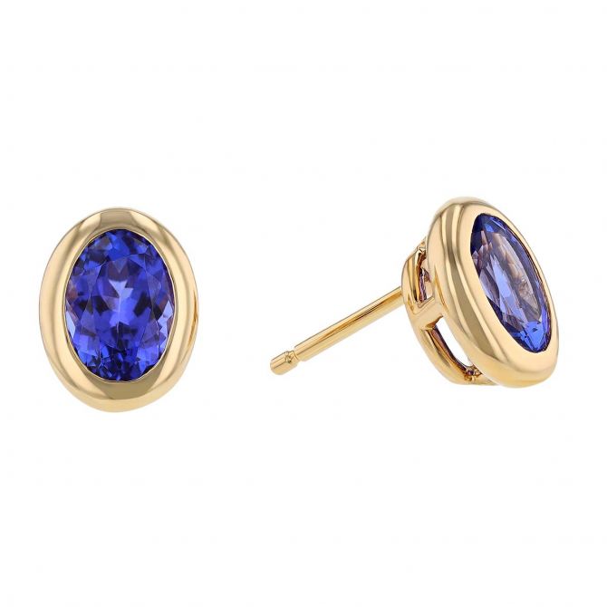 Oval Tanzanite Bezel Set Stud Earrings in Yellow Gold