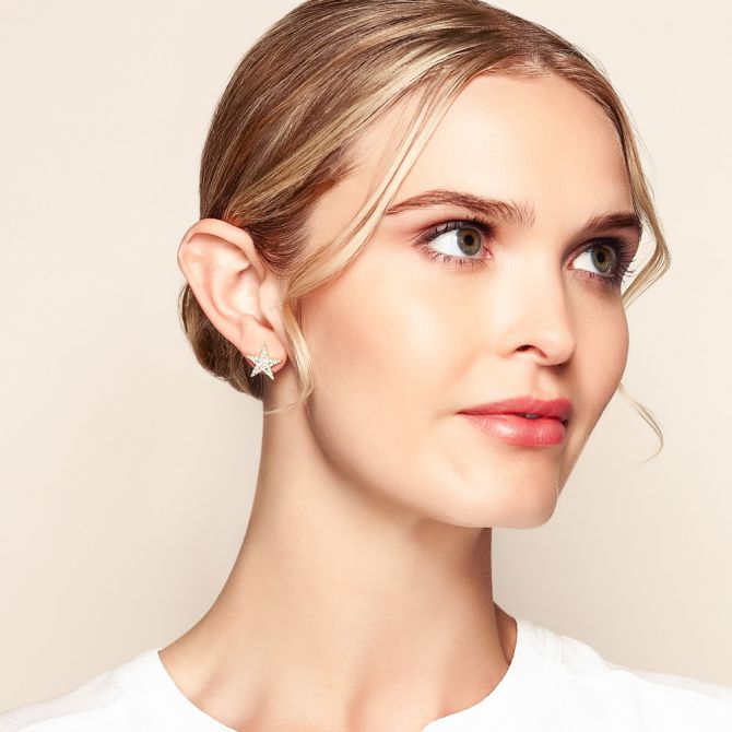 star earrings on model
