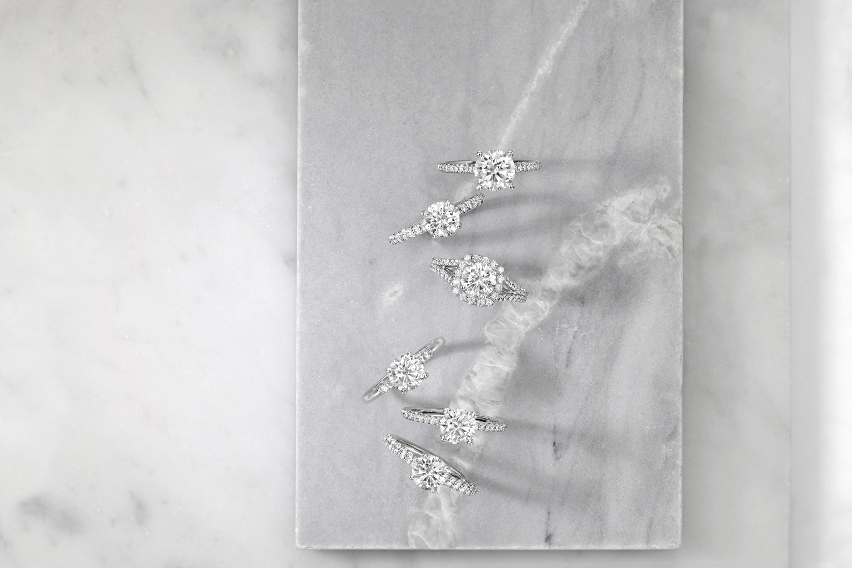 Various shapes, carat weights and clarity of diamond rings
