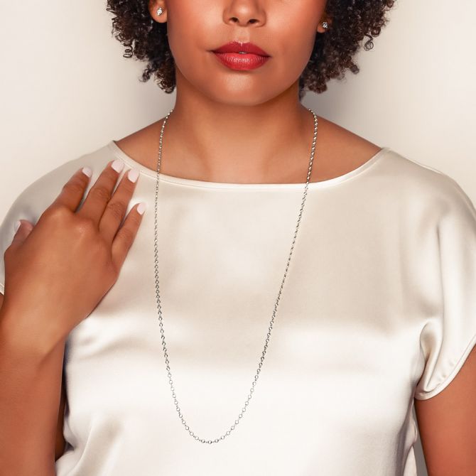 Woman wearing 36-inch diamond bezel station necklace