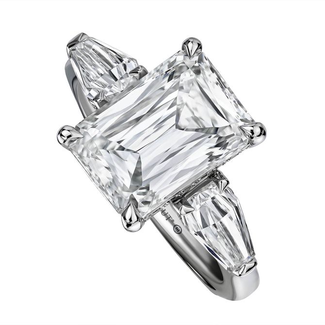 Emerald cut engagement ring with baguette diamond side stones