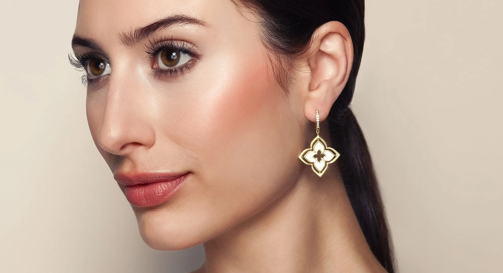 Woman wearing mother of pearl earrings