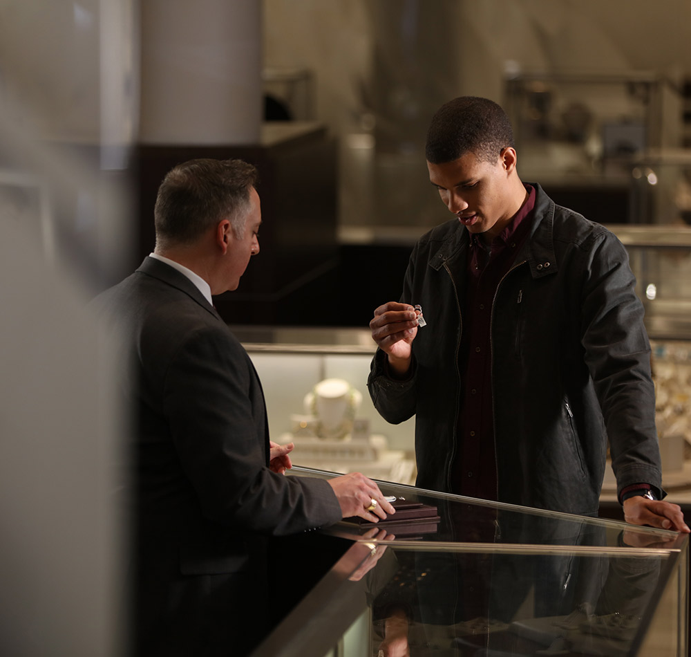 associate helping someone find a ring