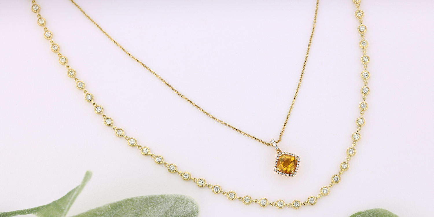 citrine necklace layered with diamond necklace