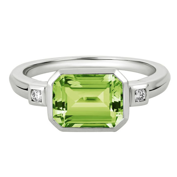 Emerald Cut Peridot Bezel Set Ring with Diamond Side Stones in White Gold