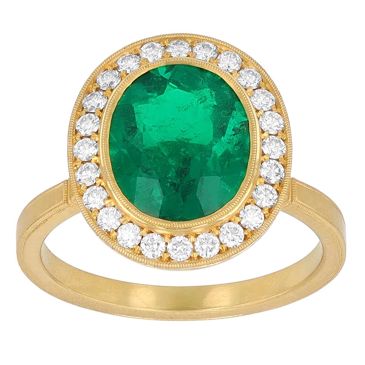 Oval Emerald & Diamond Halo Ring in Yellow Gold