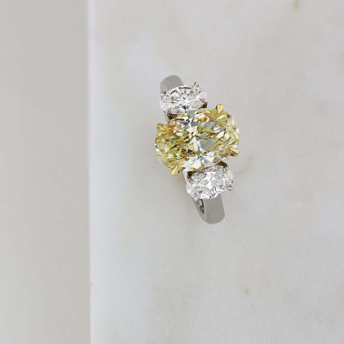 Fancy Light Yellow Oval Diamond 3 Stone Ring in Platinum