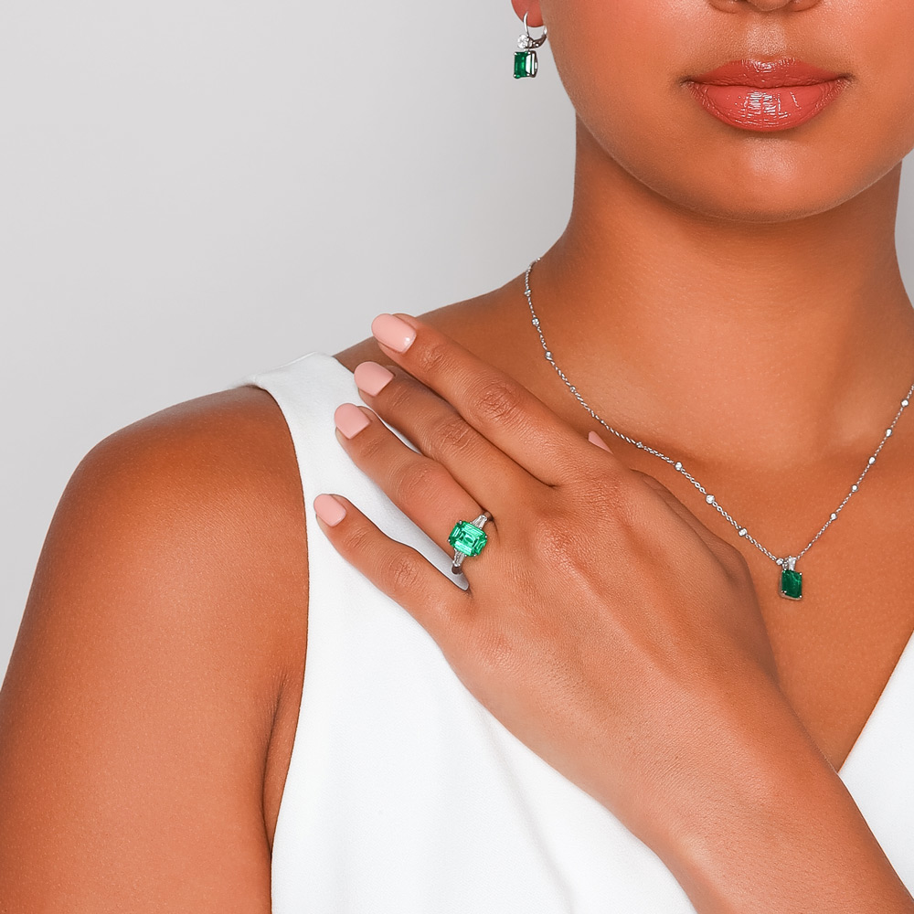 J.B. Star Emerald Cut Emerald & Tapered Baguette Diamond 3 Stone Ring in Platinum